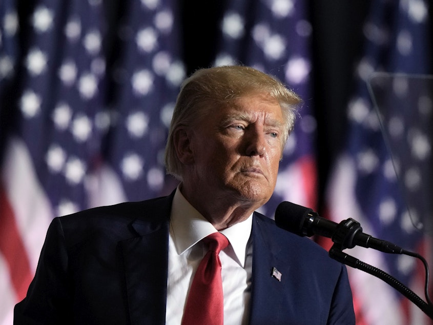 caption: Former President Donald Trump speaks on July 7 in Council Bluffs, Iowa. Trump said Tuesday that he has received a letter informing him that he is a target of the Justice Department's investigation into efforts to undo the results of the 2020 presidential election.