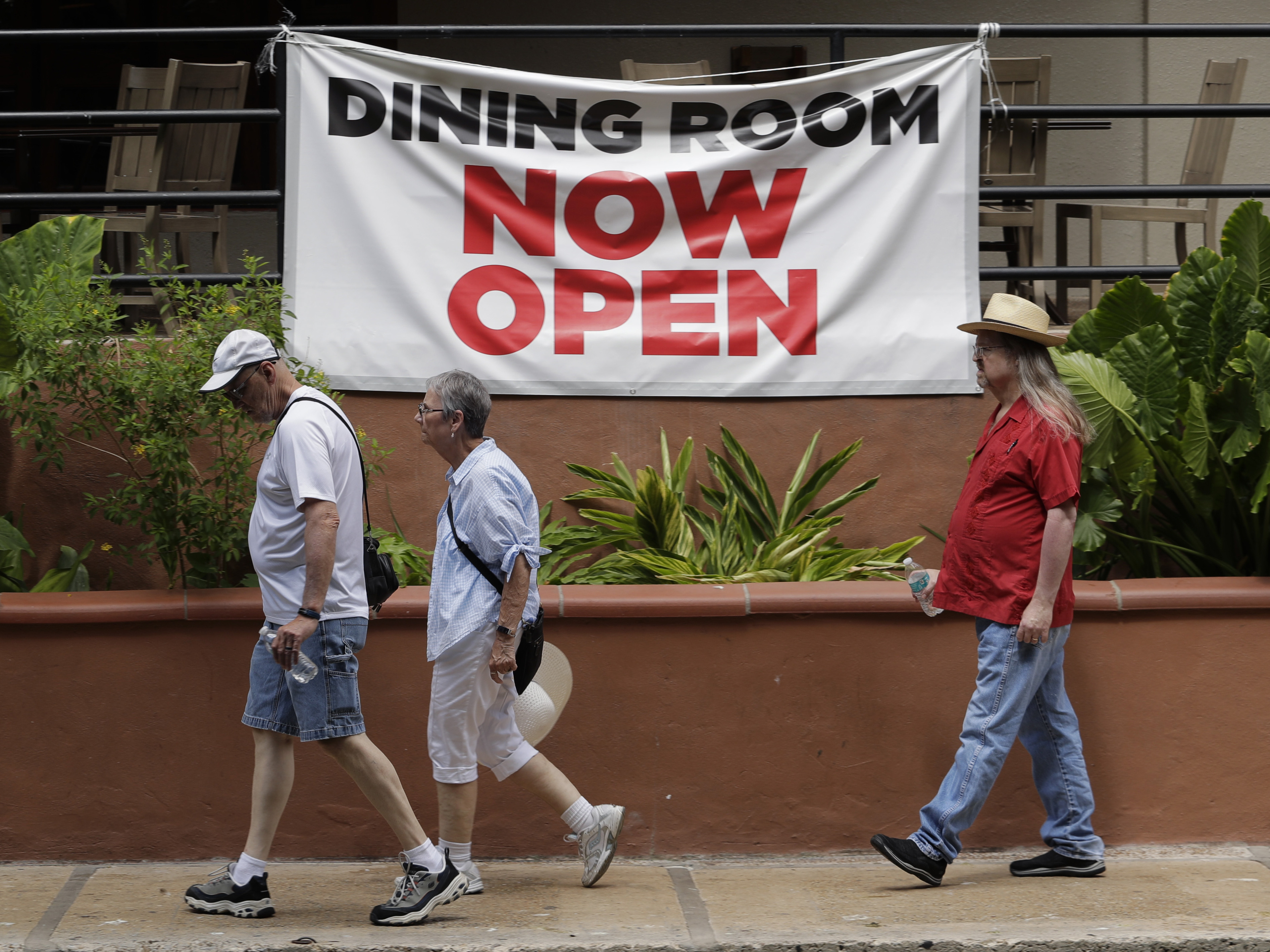 caption: Texas has seen a recent uptick in the number of COVID-19 cases, with a record level of new cases and hospitalizations announced Tuesday. People are seen here  Monday along the San Antonio River Walk.