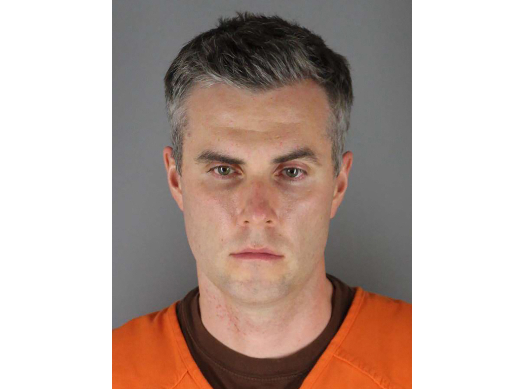 caption: Former Minneapolis police officer Thomas Lane pleaded guilty Wednesday to a state charge of aiding and abetting second-degree manslaughter in the killing of George Floyd.