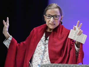 caption: FILE - In this Oct. 3, 2019 file photo, U.S. FILE - Supreme Court Justice Ruth Bader Ginsburg gestures to students before she speaks at Amherst College in Amherst, Mass, on Oct. 3, 2019. Ginsburg is being remembered during ceremonies at the Supreme Court on Friday, March 17, 2023. (AP Photo/Jessica Hill, File)