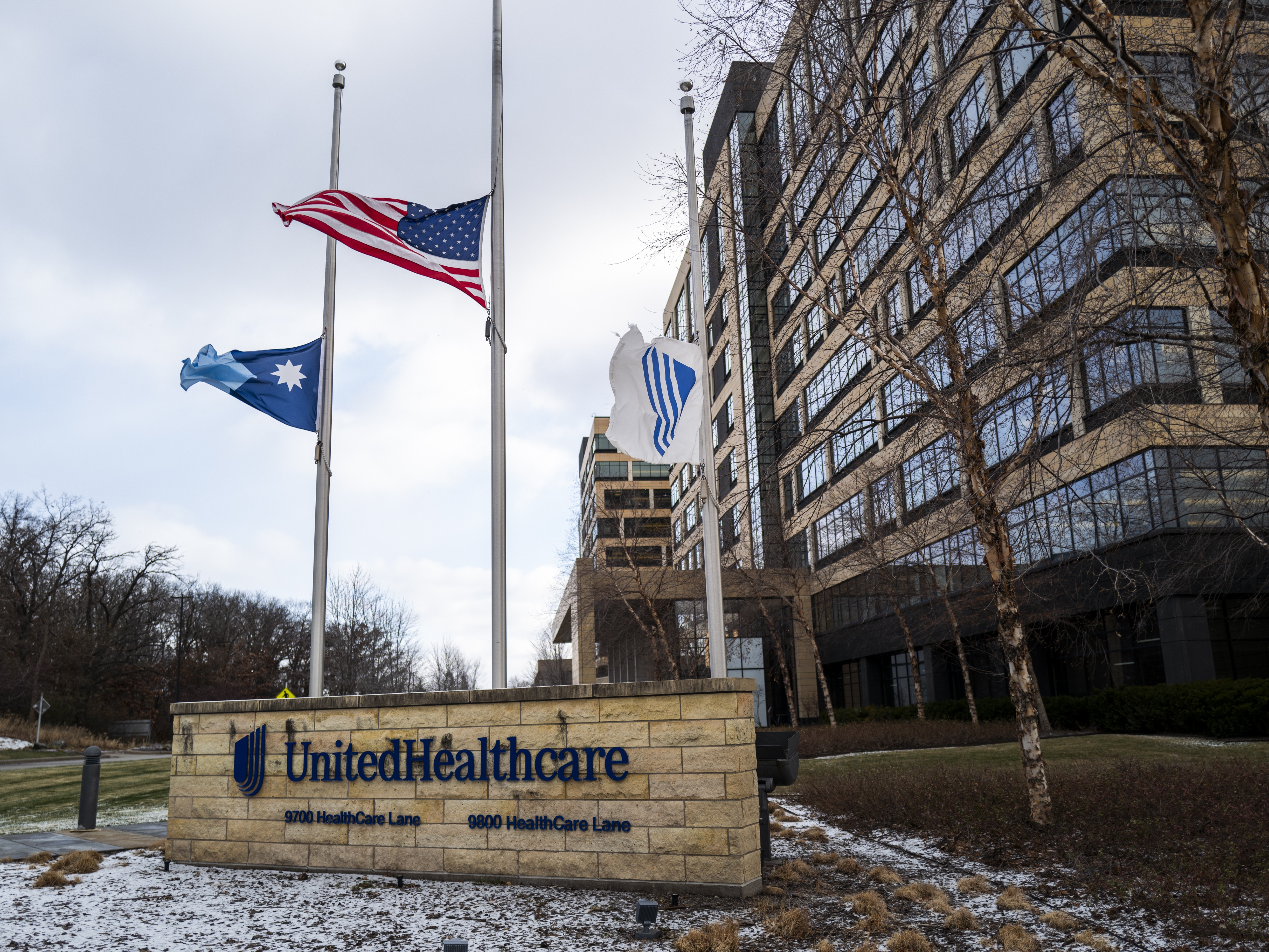 caption: Flags fly at half-staff outside the UnitedHealthcare corporate headquarters in Minnetonka, Minn., on Dec. 4, 2024, after CEO Brian Thompson was shot dead on a street in New York City. The shocking act of violence sparked a widespread consumer outcry over U.S. health care costs and denied claims.