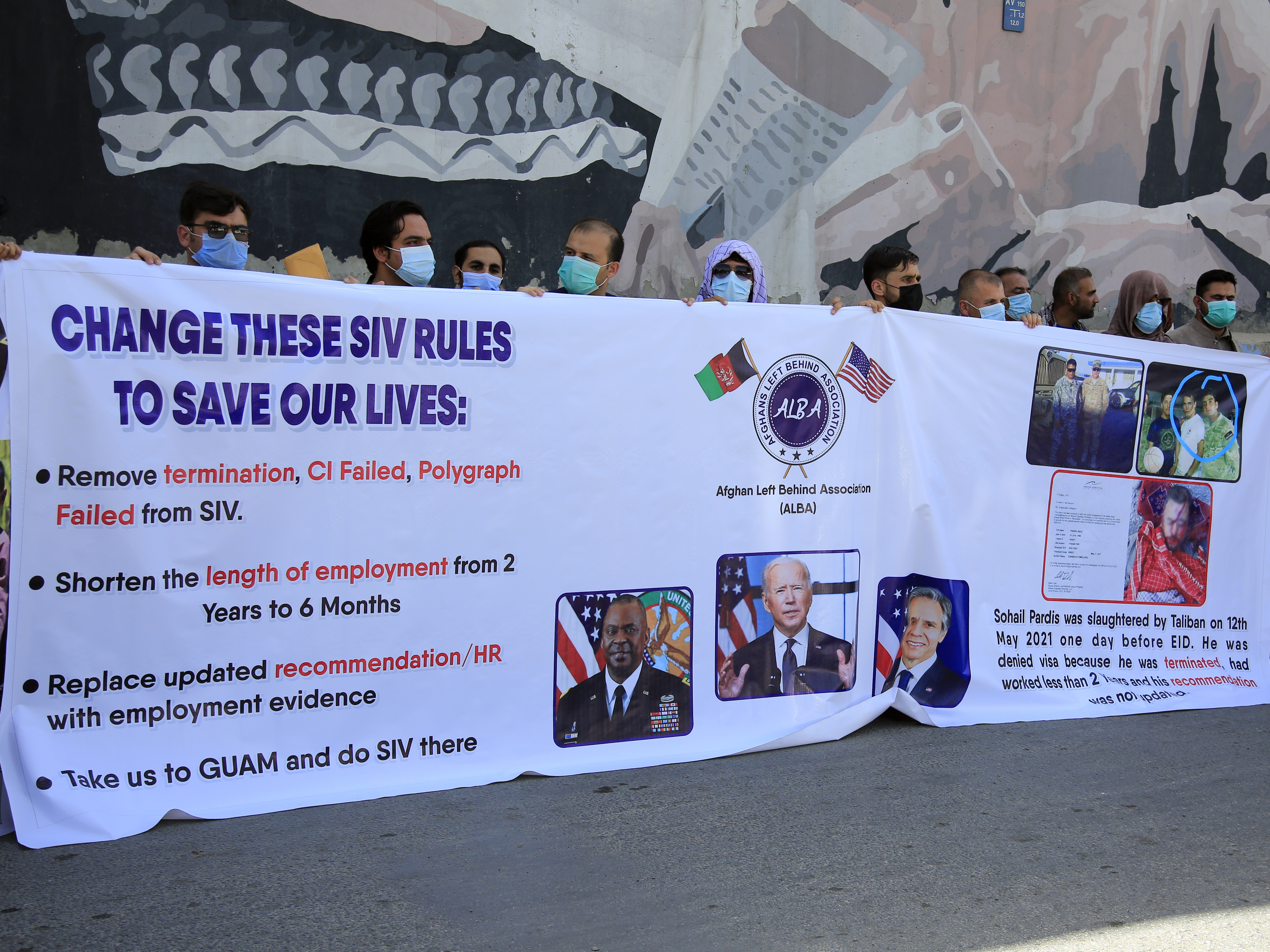 caption: Former Afghan interpreters demonstrate in June outside the U.S. Embassy in Kabul. They called for the Biden administration to modify the rules and speed up the processing of U.S. visas that have been promised to Afghans who worked for the U.S. military over the past two decades. The visas are known as Special Immigrant Visas, or SIVs.