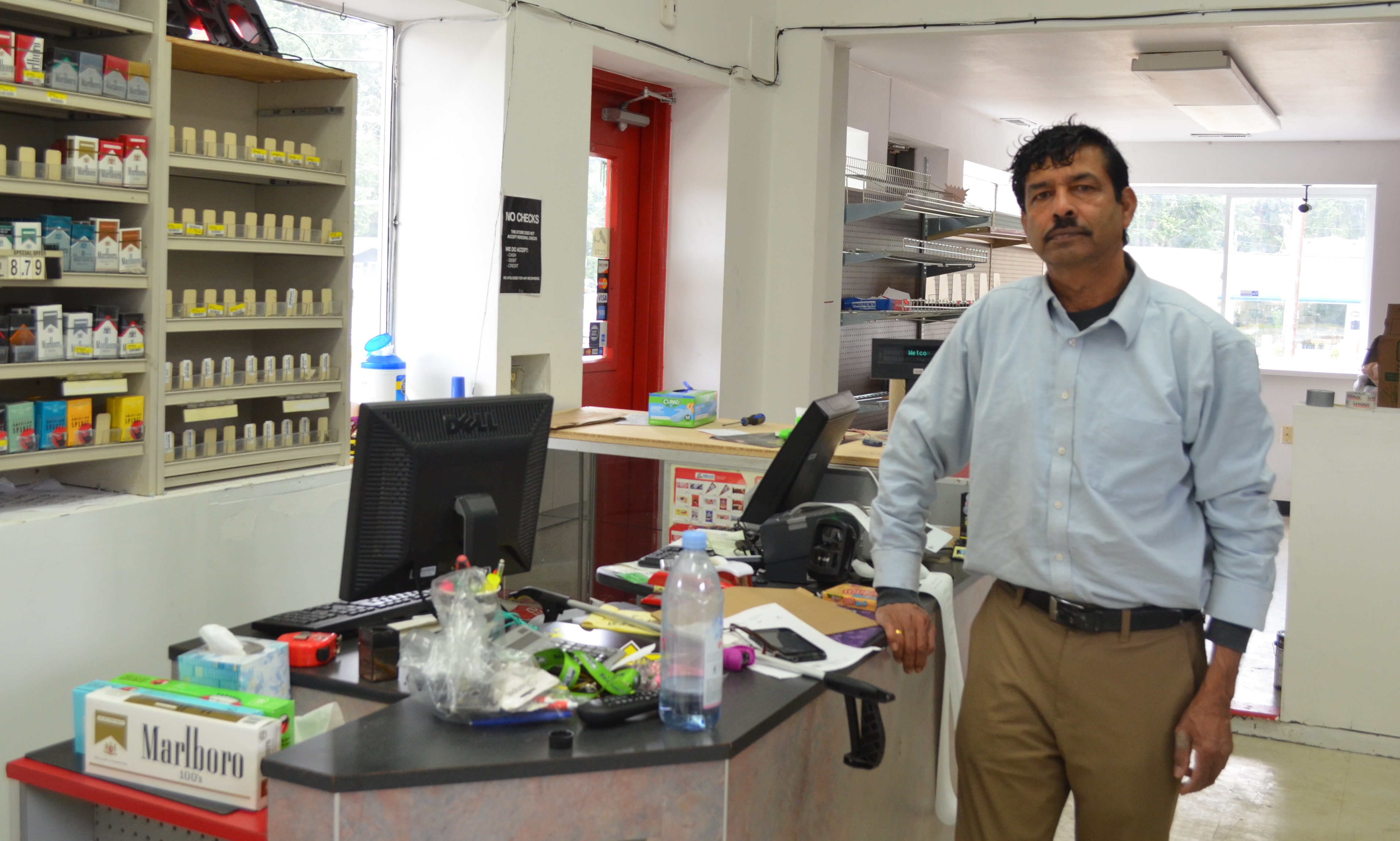 caption: Jawahar Lal at his convenience store on 100th Avenue West in Edmonds on Friday, May 31, 2019.