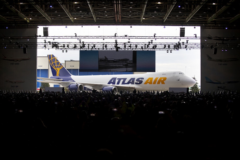 caption: The factory doors opened to display the last 747 to thousands of guests who had gathered for the celebration on Tuesday, January 31, 2023, at Boeing’s factory in Everett. 