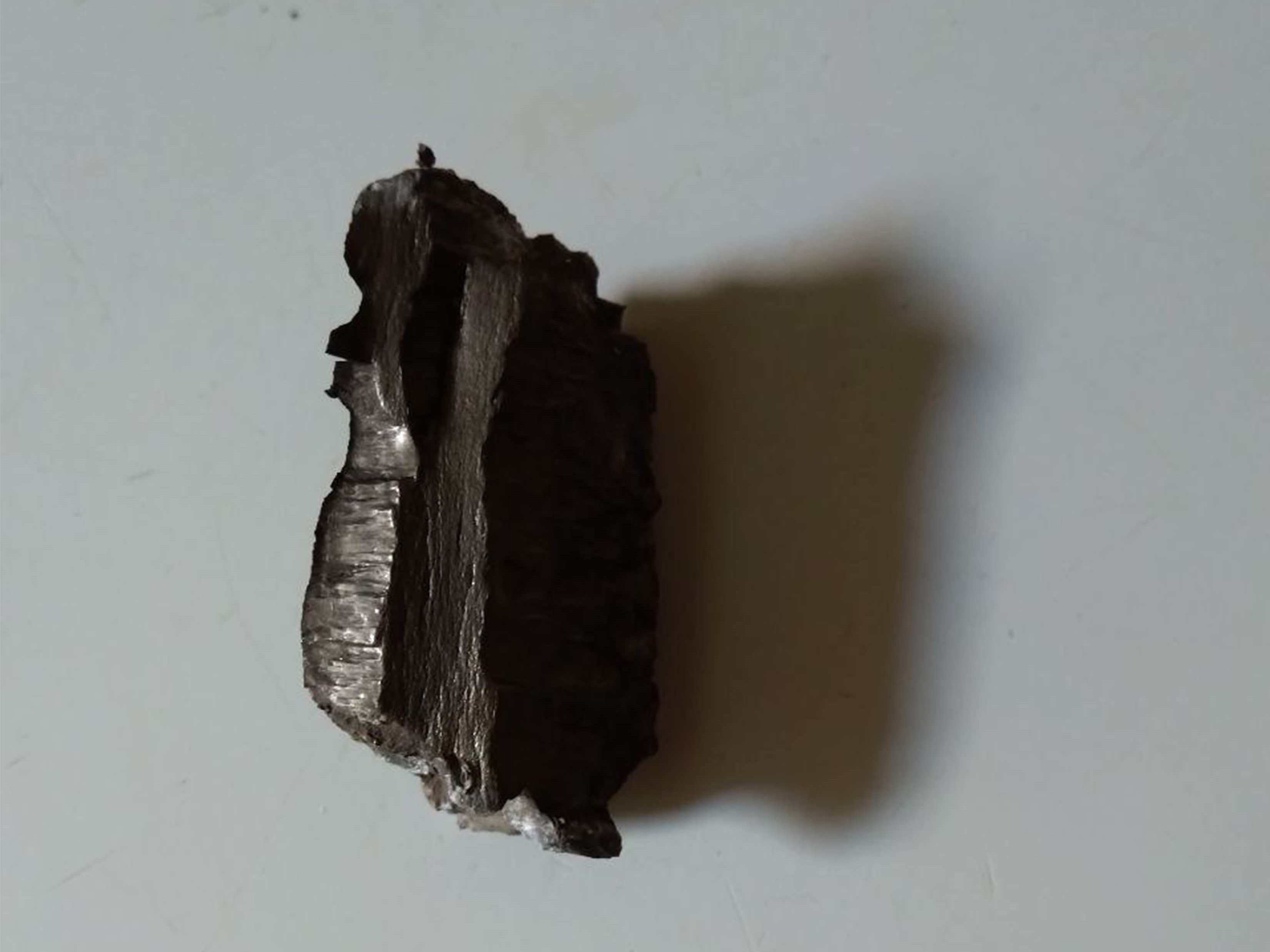 caption: A shard of shrapnel protrudes from a wall. City Hospital No. 2 has routinely operated on patients who've needed shrapnel and bullets extracted from their bodies.