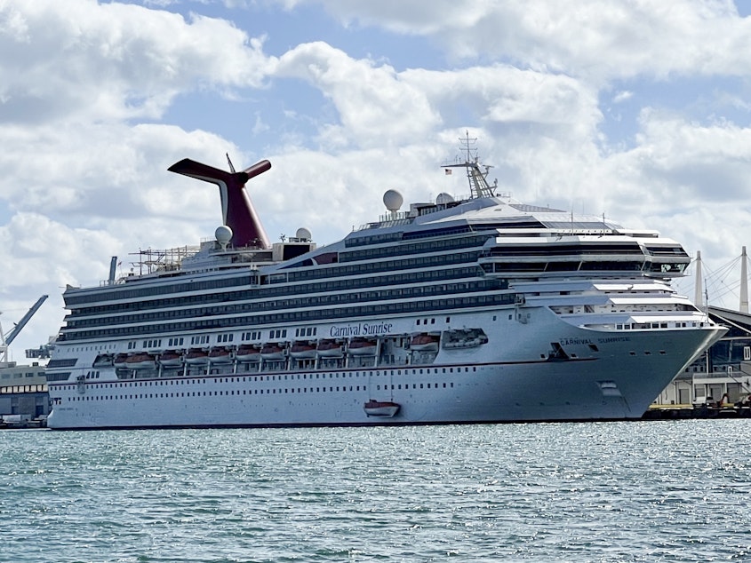 caption: The Carnival Cruise Line's Carnival Sunrise ship is seen in the port of Miami on Dec. 23, 2020, amid the coronavirus pandemic.