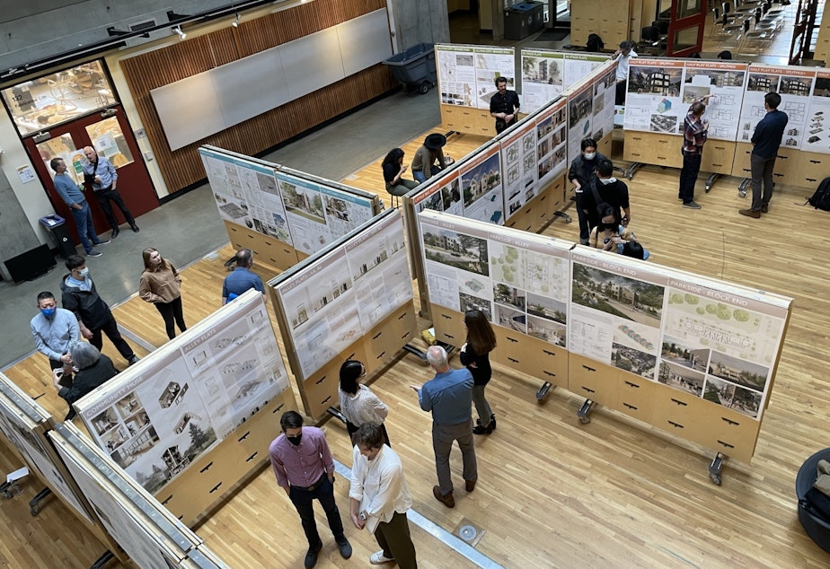 caption: Students present their projects to community experts - including architects and planners who'll have a hand in writing Seattle's Comprehensive Plan Update. Gould Hall, UW Campus, June 6, 2022