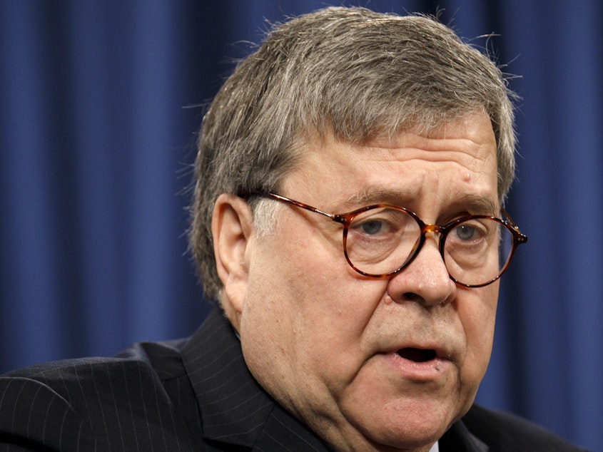 caption: Attorney General William Barr at a news conference on Monday at the Justice Department.