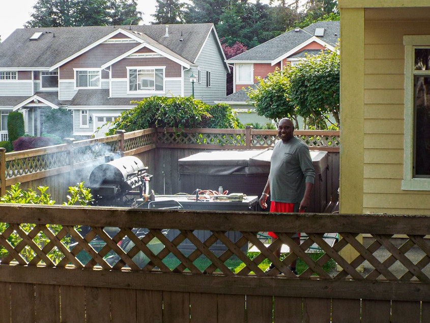 caption: Jay Smalls barbecues what smells like baby back ribs on a sunny Sunday in Renton, Washington.