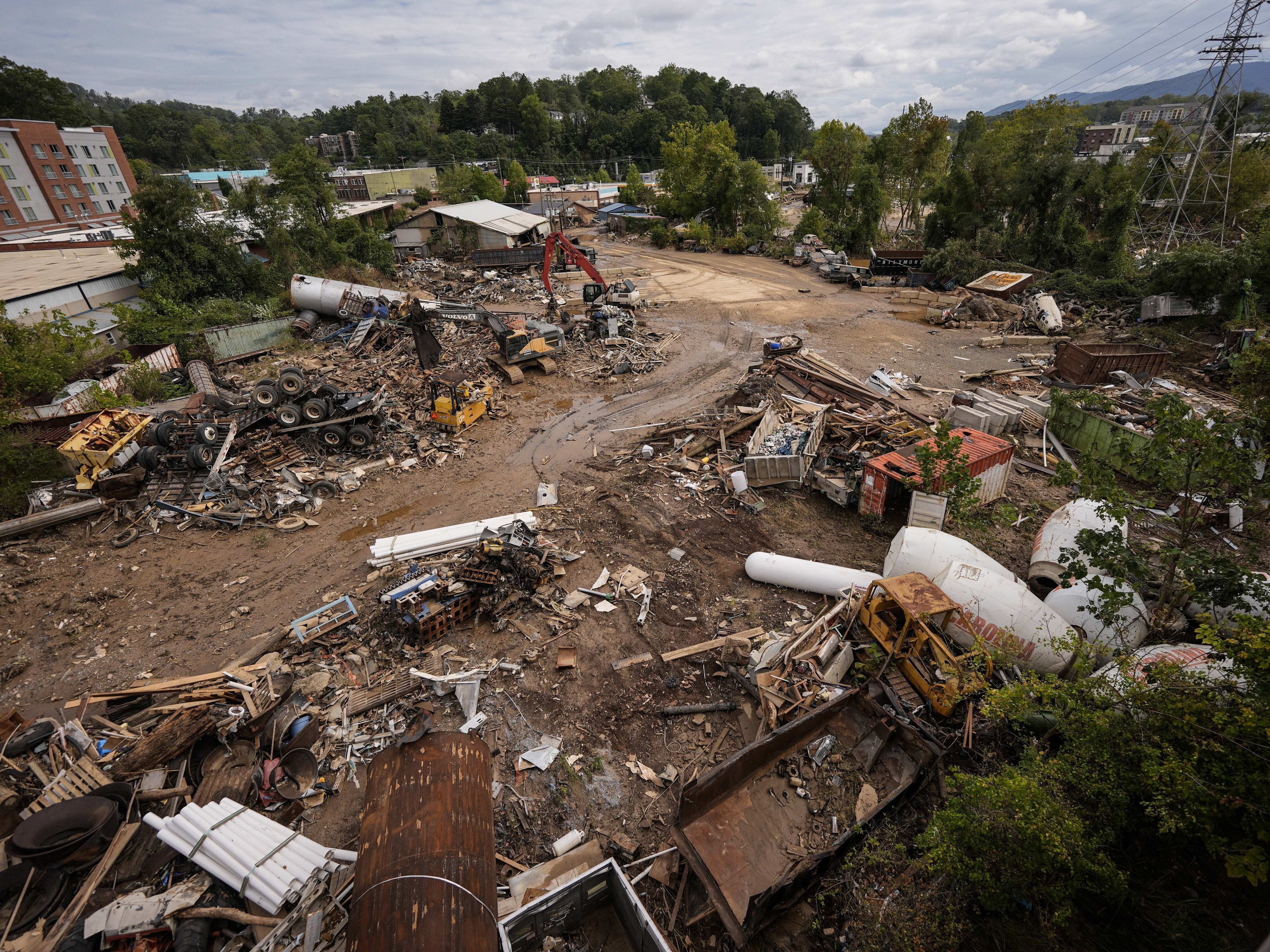 caption: Debris seen in the aftermath of Hurricane Helene on September 30, in Asheville, N.C.