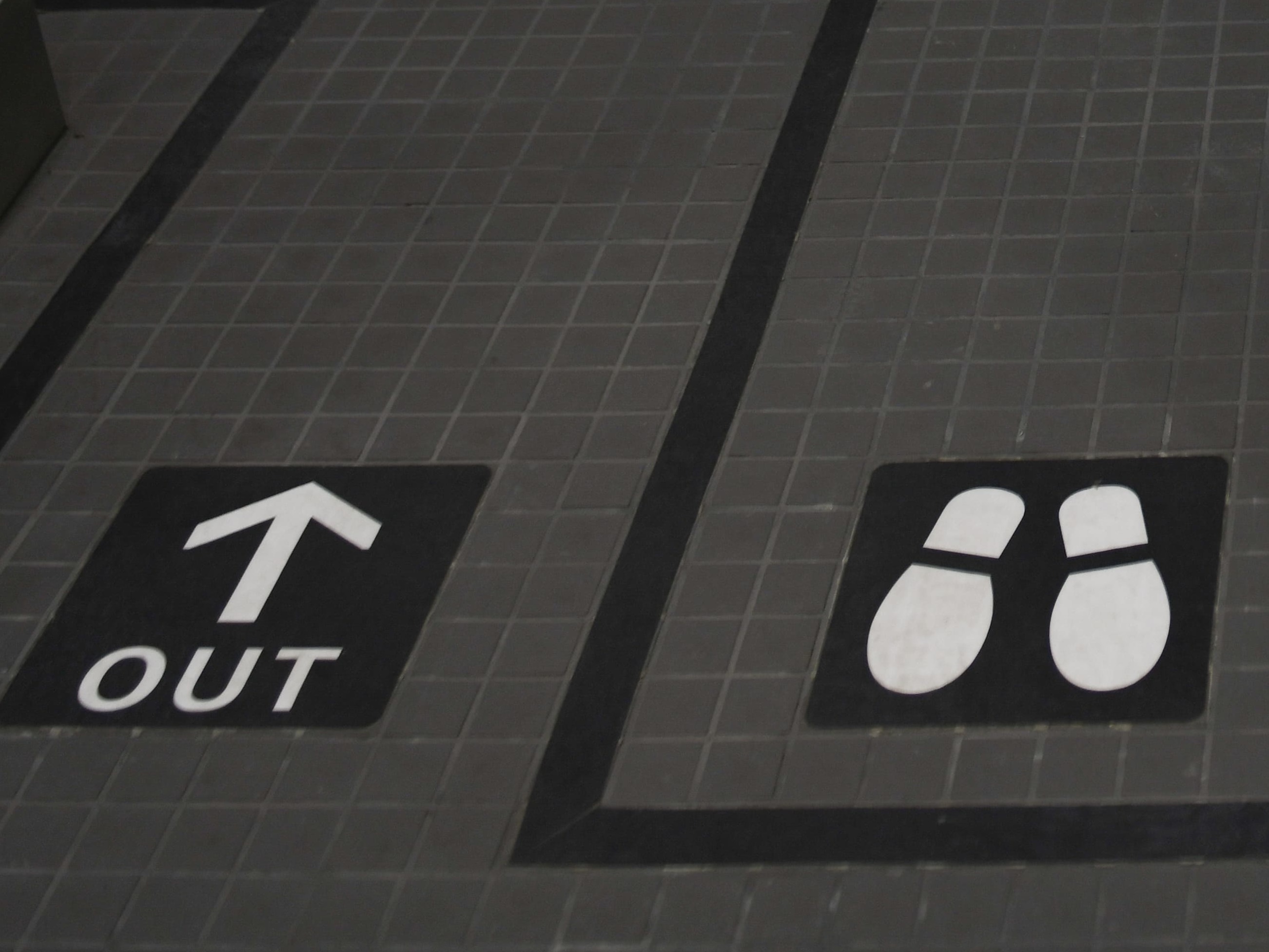 caption: Toyota, Panasonic and other big Japanese firms are distancing themselves from the Tokyo Olympics, despite spending millions to sponsor the Games. Here, guide lines are seen on the floor inside National Stadium, the main venue for the Tokyo 2020 Olympic and Paralympic Games.