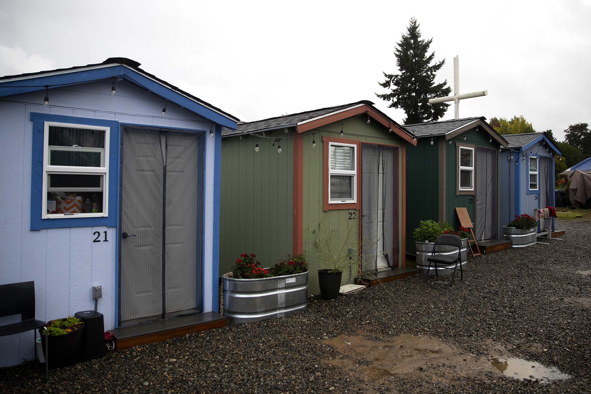 caption: FILE: Tiny homes are shown on Monday, October 16, 2023, at Riverton Park United Methodist Church in Tukwila. 