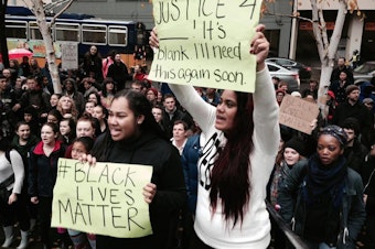 caption: Demonstrators at a Seattle march on Nov. 25, 2014, in response to the Ferguson grand jury decision.