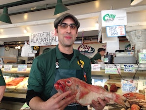caption: Fishmonger Andrew Wichmann says cruise ship traffic is great for Seattle but doesn't do much for him directly. They can't bring food onboard. "We wouldn't survive without local clientele."