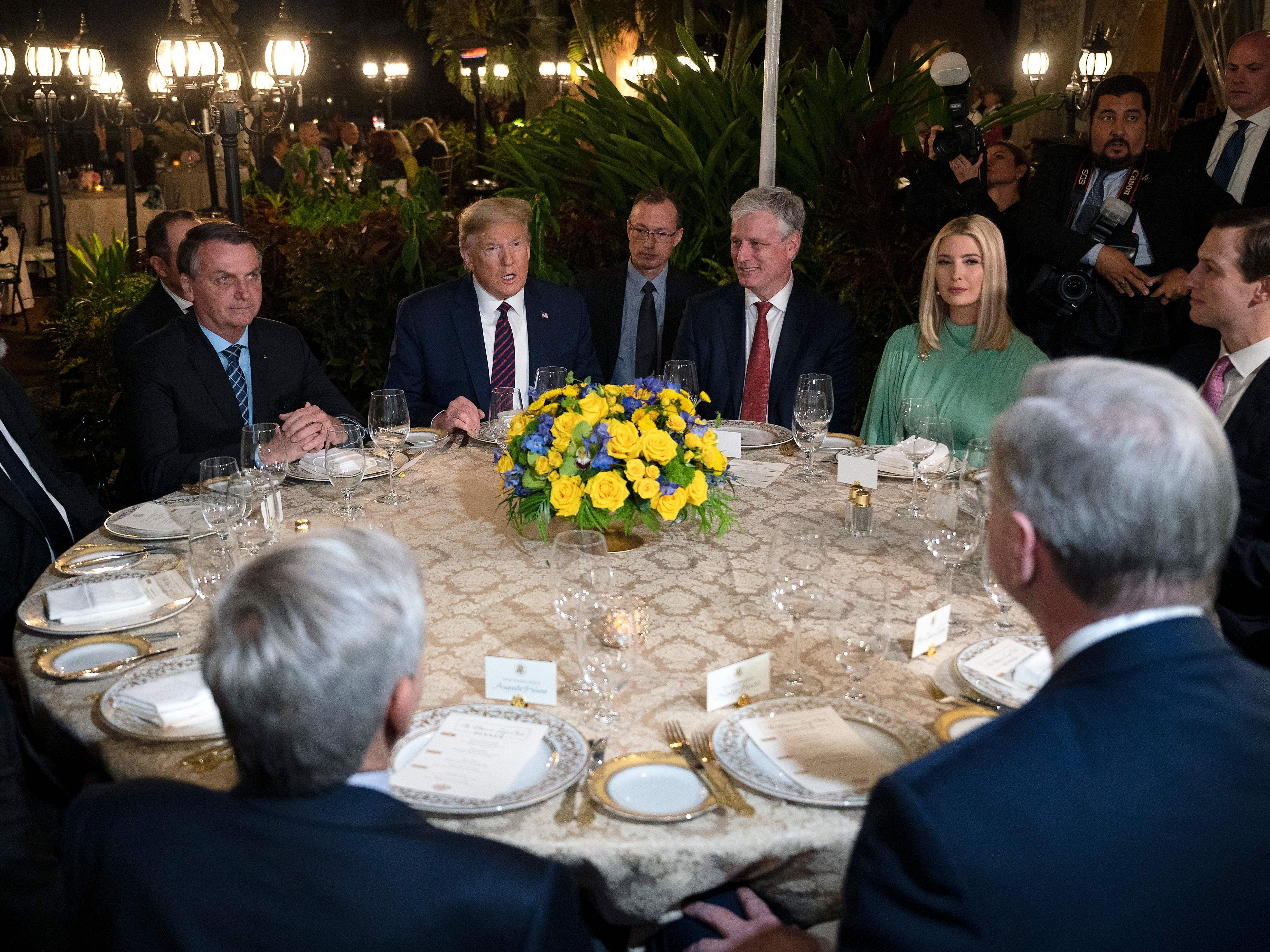 caption: President Donald Trump and other U.S. officials met with Brazilian President Jair Bolsonaro and his delegation last weekend at Mar-a-Lago in Palm Beach, Florida.