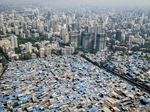 caption: In Mumbai, some prosperous neighborhoods sit alongside slums. This year's Gates report on progress toward eliminating poverty notes that there is vast inequality not only between nations, but within many of them.