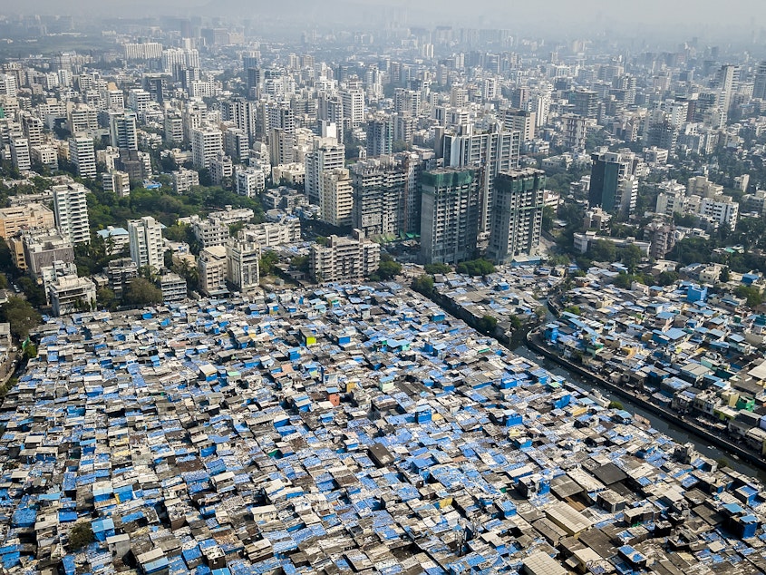 caption: In Mumbai, some prosperous neighborhoods sit alongside slums. This year's Gates report on progress toward eliminating poverty notes that there is vast inequality not only between nations, but within many of them.