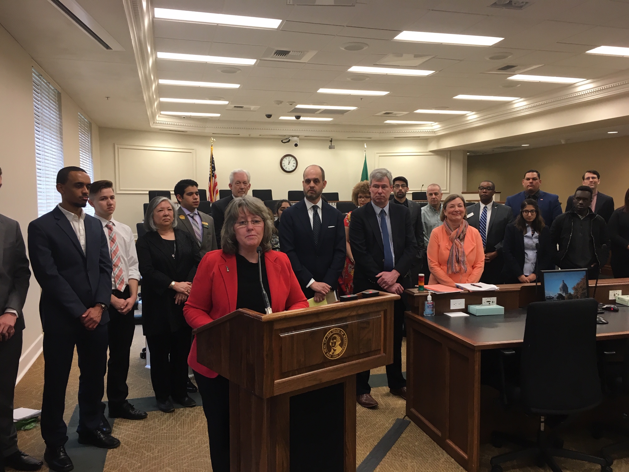 caption: State Rep. Gael Tarleton speaks at a news conference to unveil the House Democratic budget on Monday.