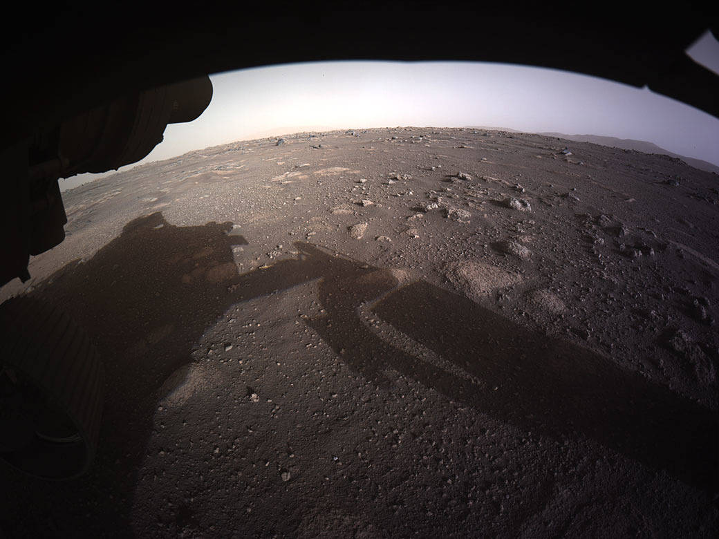 caption: The first high-resolution full-color image of the Martian surface by Perseverance, taken by the Hazard Cameras on the underside of the rover.