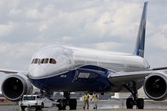 caption: Boeing employees walk the new Boeing 787-10 Dreamliner down towards the delivery ramp area at the company's facility after conducting its first test flight at Charleston International Airport in 2017. A Senate subcommittee has opened an investigation into the safety of Boeing jetliners, intensifying safety concerns about the company's aircraft.