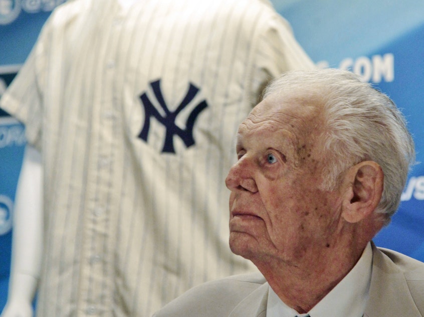 caption: In this photo from June 28, 2012, New York Yankees great Don Larsen reacts during a news conference announcing the auction of his 1956 perfect game uniform. He died Wednesday at age 90.