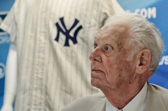 caption: In this photo from June 28, 2012, New York Yankees great Don Larsen reacts during a news conference announcing the auction of his 1956 perfect game uniform. He died Wednesday at age 90.