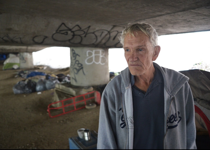 caption: Donald Slyter, a resident of The Jungle, a homeless encampment in Seattle believed to have been around since the 1930s. It gets its name from the name for homeless encampments at the time -- hobo jungles. 