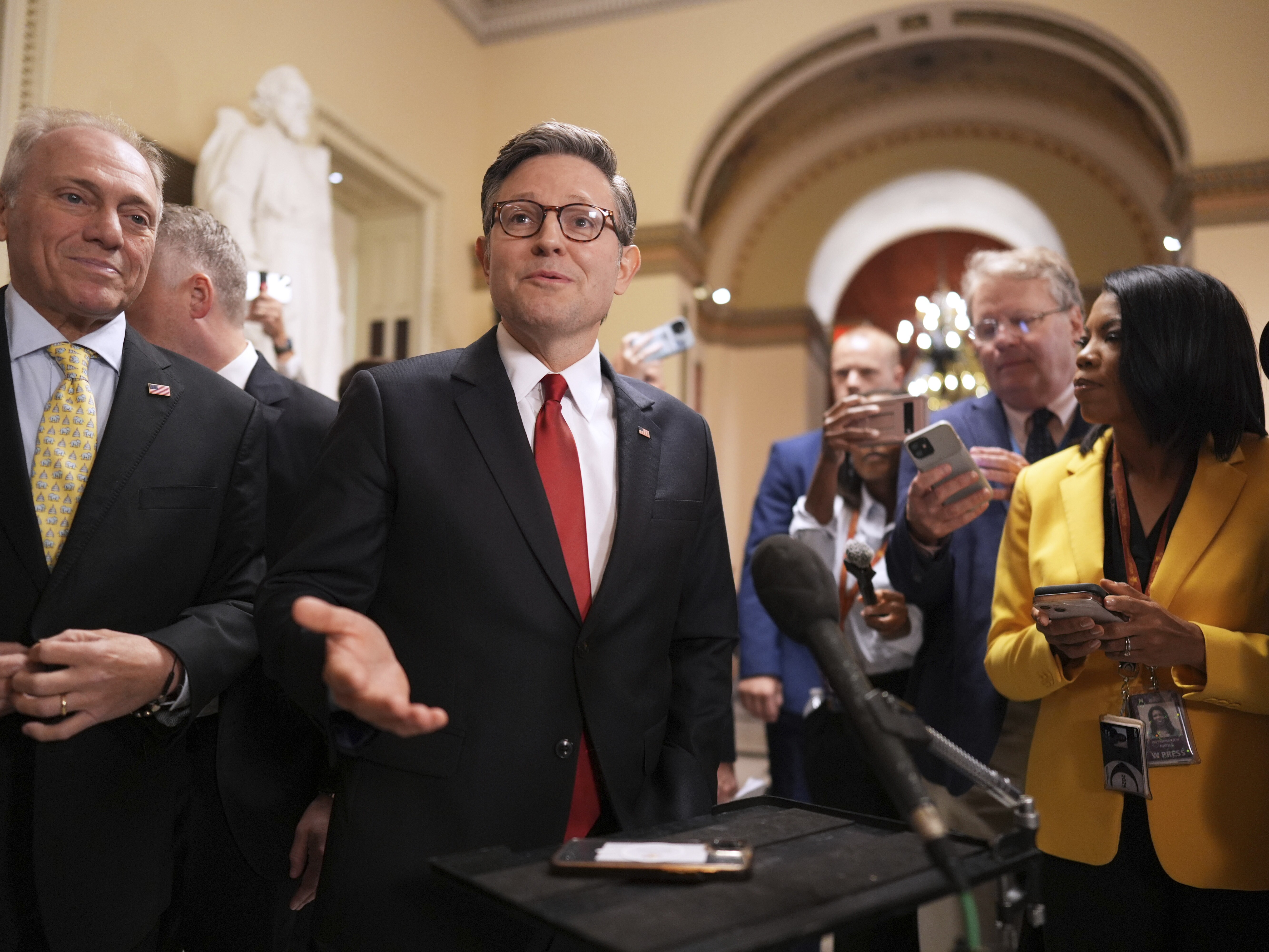 caption: Speaker of the House Mike Johnson, R-La., with House Majority Leader Steve Scalise, R-La., left, speaks to reporters as he heads to the chamber, at the U.S. Capitol on Wednesday.