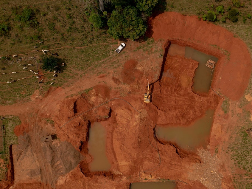 caption: An illegal gold mine in Brazil.