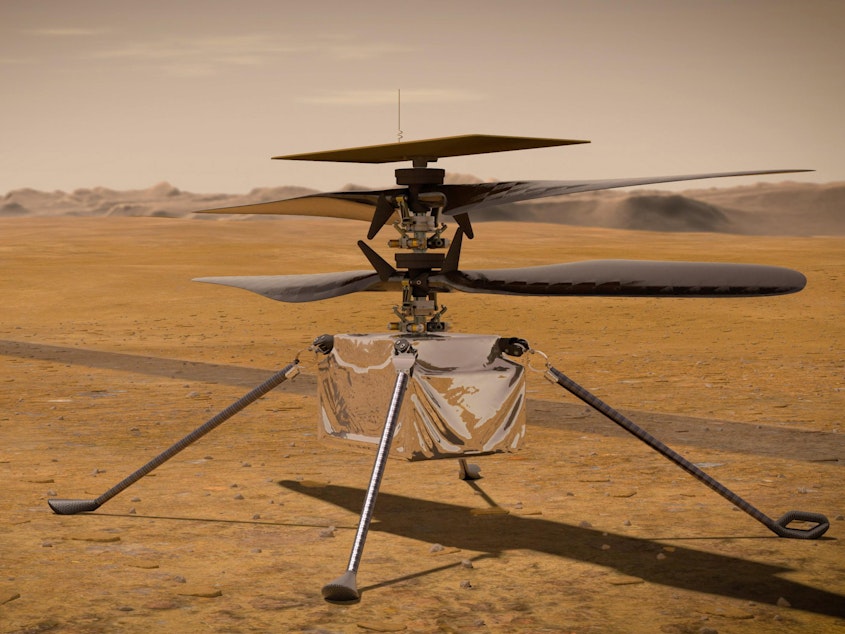 caption: An illustration from NASA shows the Ingenuity Mars helicopter on the red planet's surface near the Perseverance rover, left.