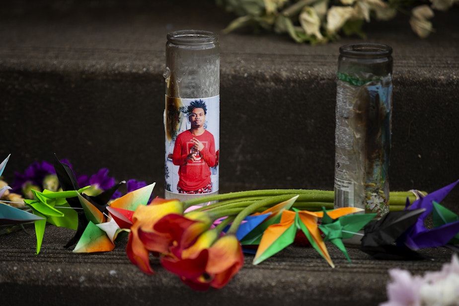 caption: A photograph of 17-year-old Garfield High School student Amarr Murphy is shown on a candle in a growing memorial for the student who was shot and killed, as students return to school for the first time since his death, on Tuesday, June 11, 2024, at Garfield High School in Seattle.  