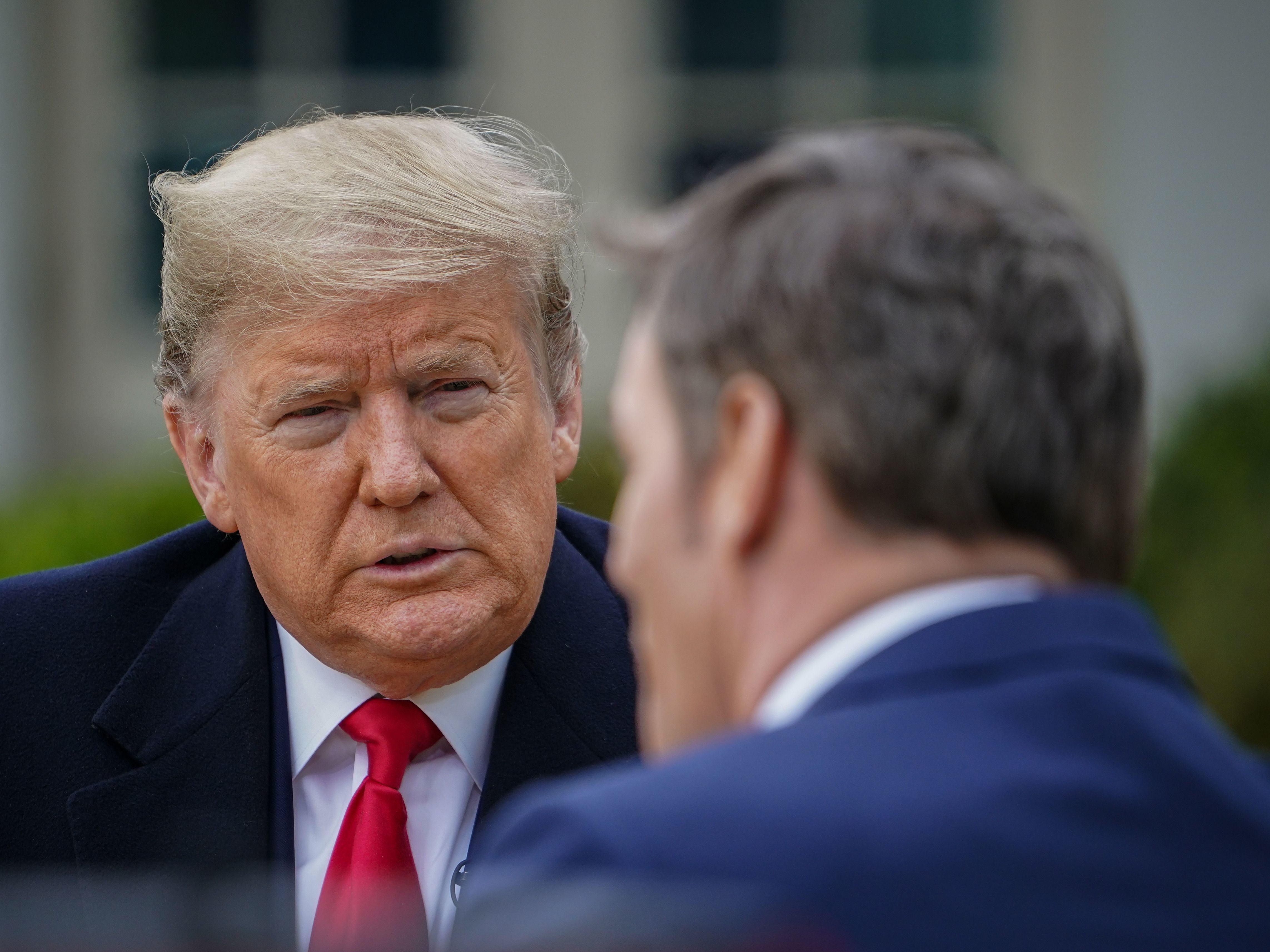 caption: President Trump speaks with anchor Bill Hemmer during a Fox News virtual town hall from the Rose Garden of the White House on Tuesday.