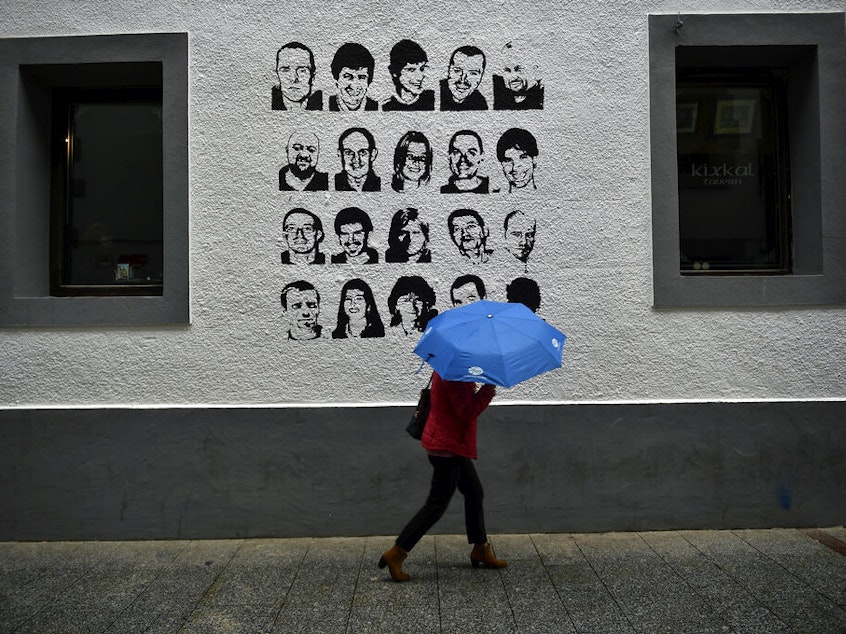 caption: A wall painted with portraits of prisoners of the Basque separatist armed group ETA, in the small village of Hernani, northern Spain, on May 2, 2018.