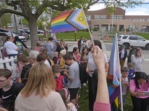 caption: Bonneville Elementary School parents and students gather during a block party supporting trans and non binary students and staff Monday, April 29, 2024, in Salt Lake City.