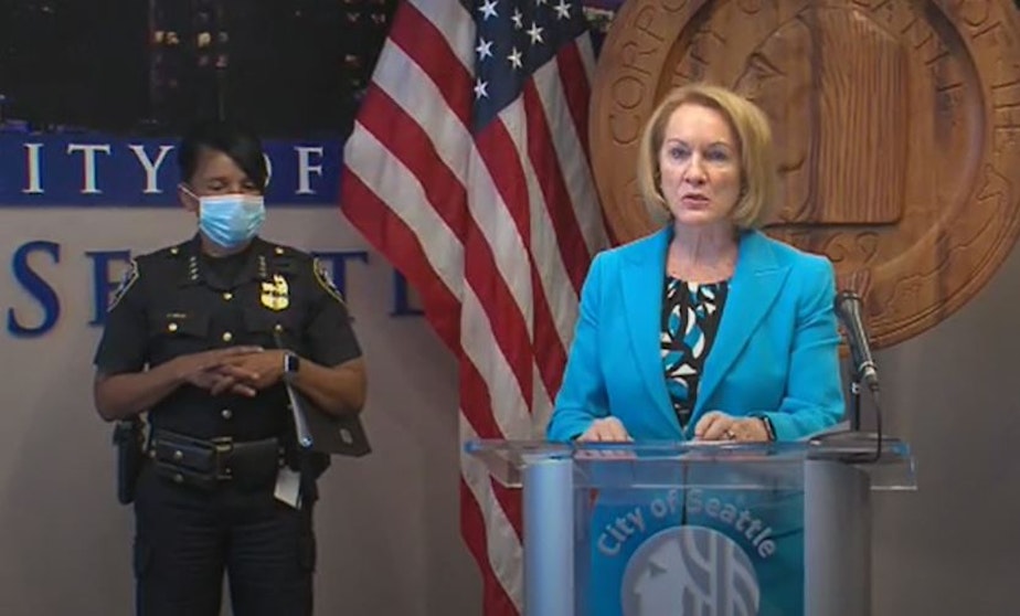 caption: Seattle Mayor Jenny Durkan, along with Police Chief Carmen Best, announce their proposal to reorganize the police department, reducing its size and funding, July 13, 2020. 