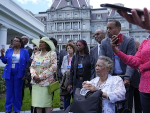 caption: Family members of plaintiffs in the historic <em>Brown v. Board of Education</em> met with President Biden to mark the 70th anniversary of the Supreme Court decision.