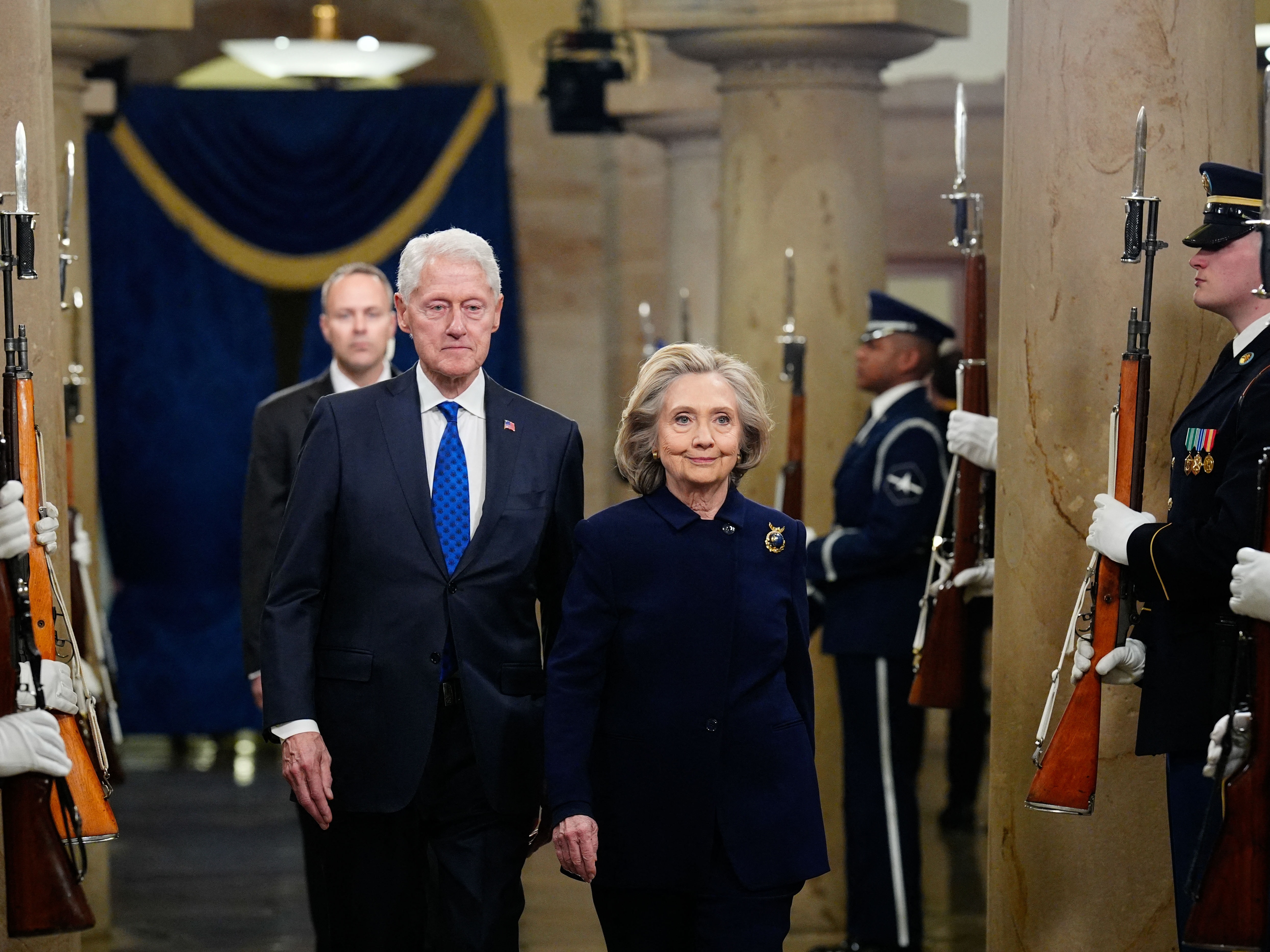 caption: Former President Bill Clinton and former Secretary of State Hillary Clinton arrive ahead of the 60th inaugural ceremony on January 20, 2025, at the U.S. Capitol.