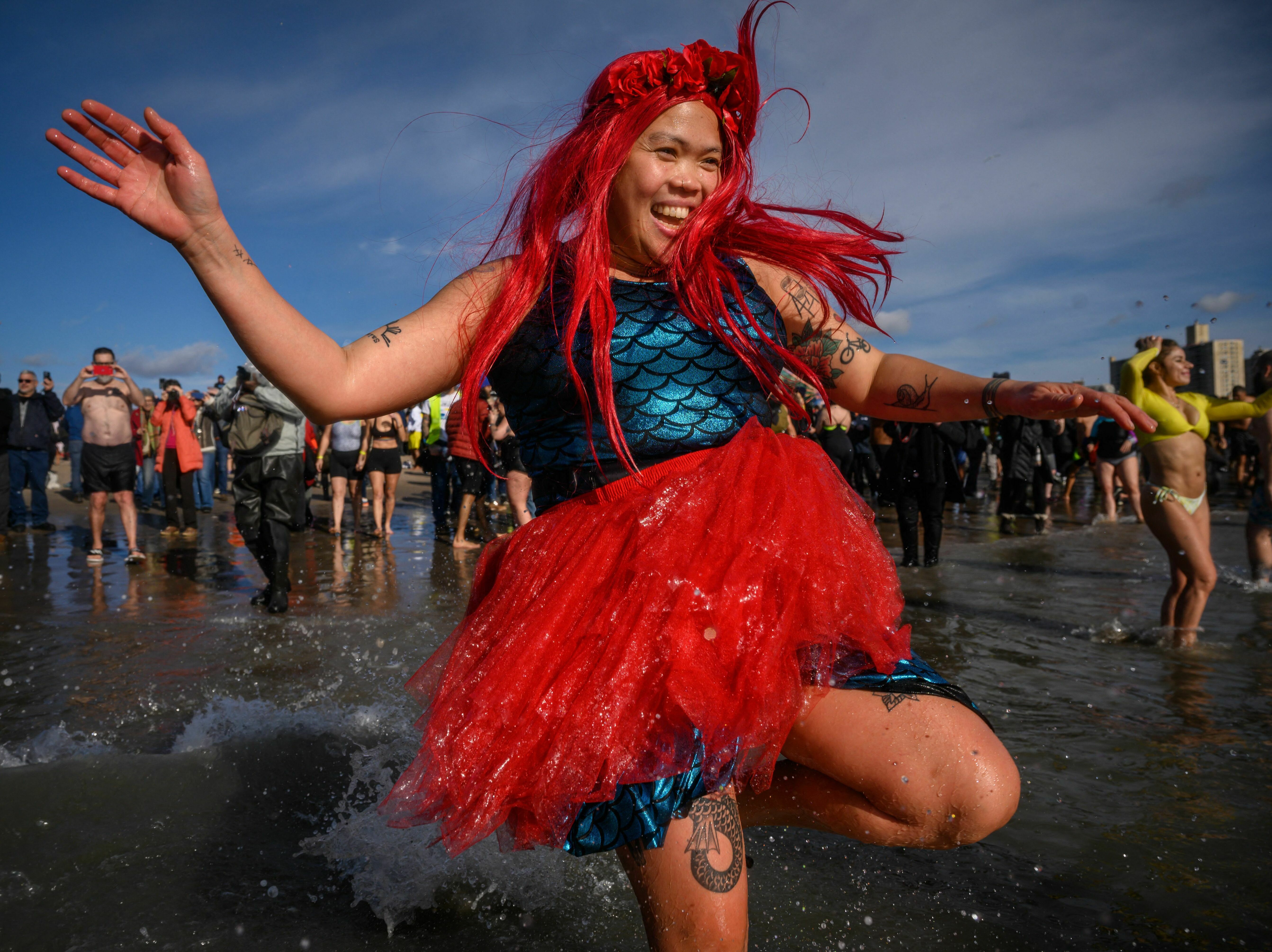 caption: A mermaid takes the annual polar bear plunge at Brooklyn's Coney Island beach last year. More people take cold plunges on a regular basis for health benefits, but hype outpaces research for now.