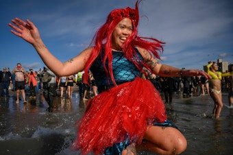 caption: A mermaid takes the annual polar bear plunge at Brooklyn's Coney Island beach last year. More people take cold plunges on a regular basis for health benefits, but hype outpaces research for now.