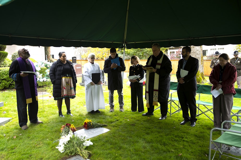 caption: Faith leaders read the names of those honored during the 2023 Indigent Remains ceremony hosted by the King County Medical Examiner’s Office on Wednesday, Oct. 25, 2023, at Mt. Olivet Cemetery in Renton. 