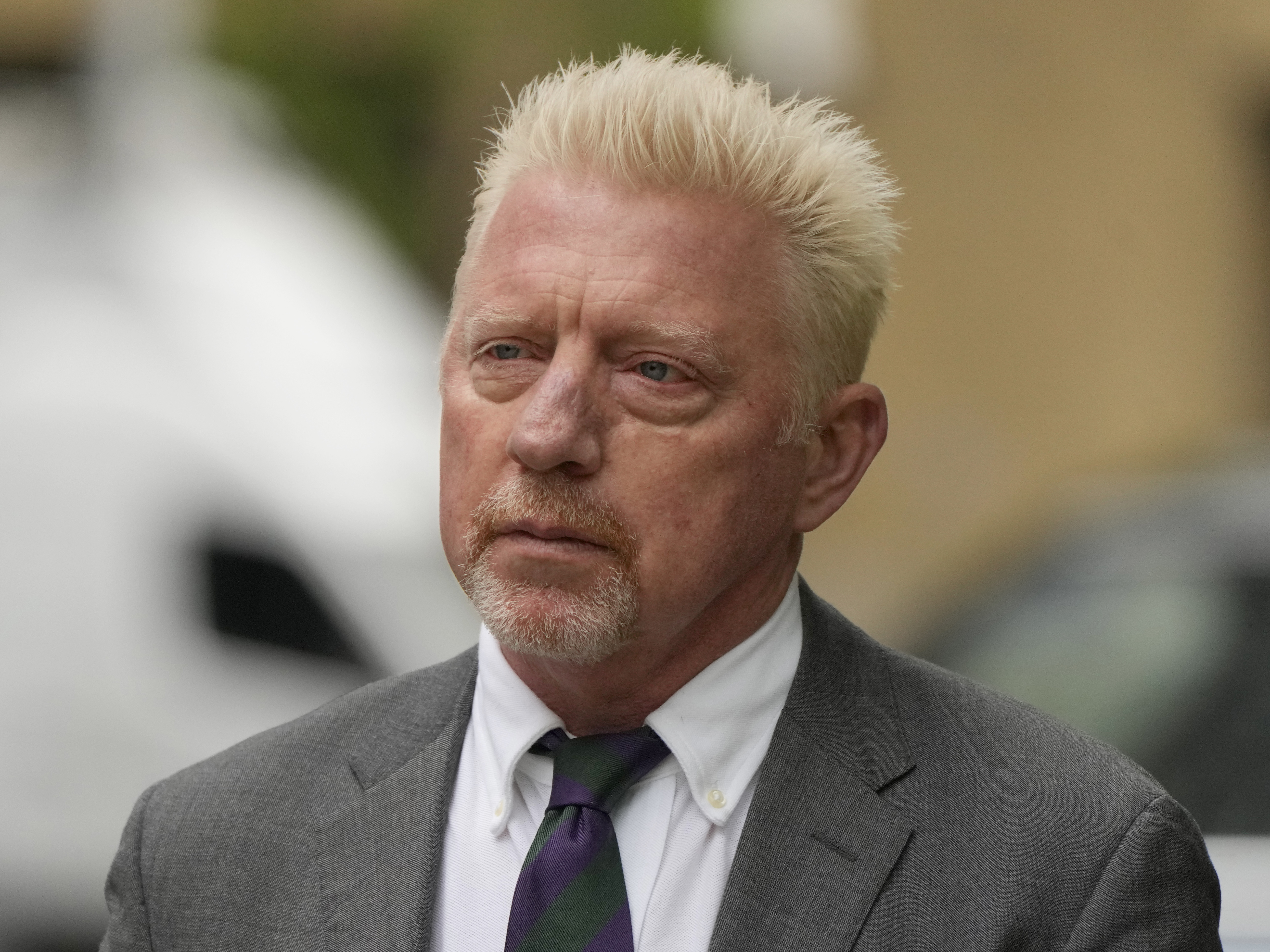 caption: Former Tennis player Boris Becker arrives at Southwark Crown Court for sentencing in London on Friday.