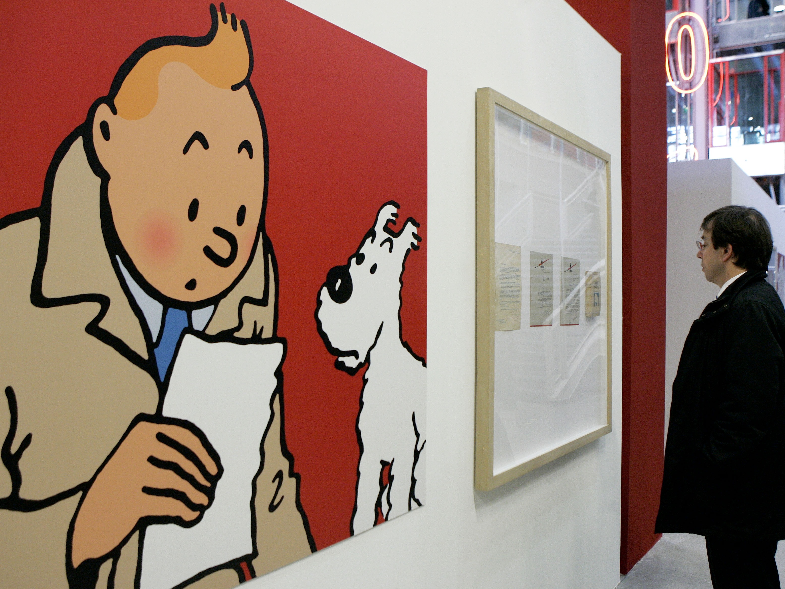 caption: An enlarged cartoon of Tintin pictured on display at Paris' Pompidou Cultural Center in 2006. The Belgian cub reporter is among the characters and works entering the public domain in 2025.