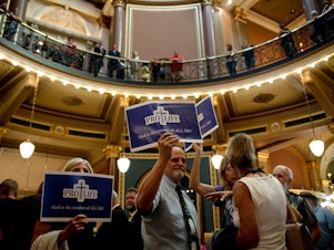 caption: In a special legislative session that lasted around 15 hours, Republican lawmakers passed a "fetal heartbeat" bill that would effectively ban abortion after six weeks on Tuesday, July 11. Hundreds of Iowans rallied at the Capitol in protest and support of the legislation, clashing often in the building's rotunda.