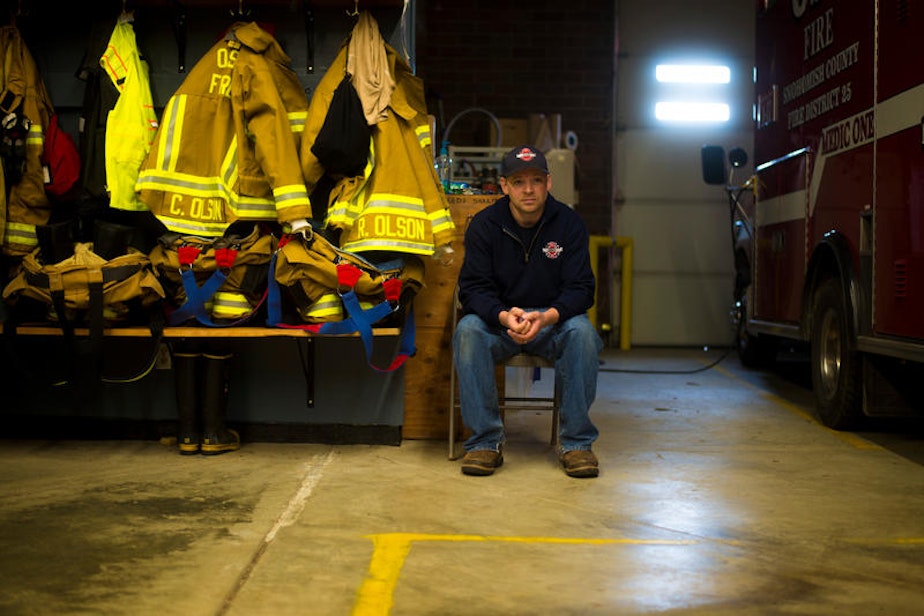 caption: Fire Chief Willy Harper inside the Oso fire house. It has reverted to a quiet volunteer fire department in the months since the slide.