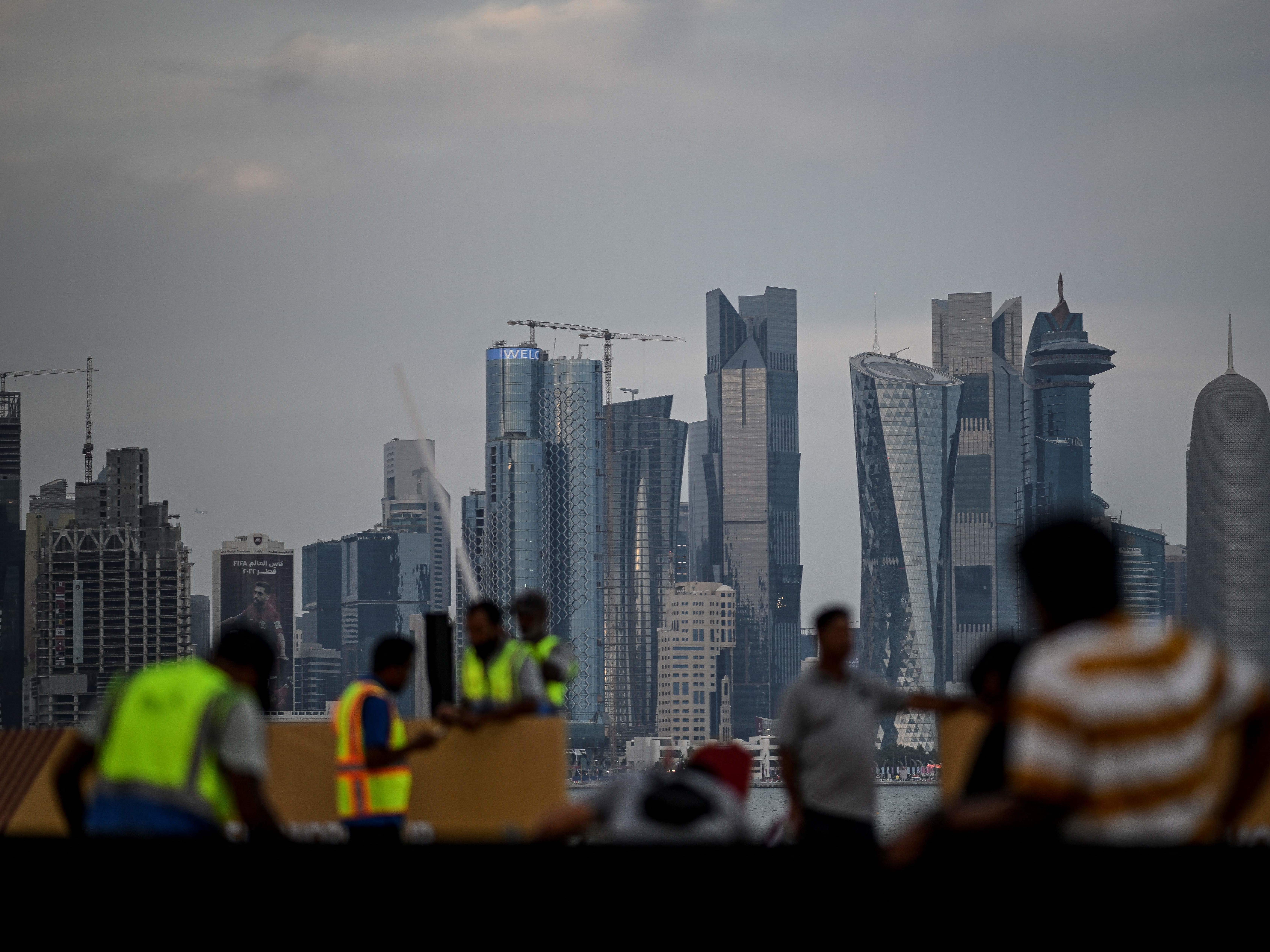 caption: Qatar relied on migrant workers to build stadiums and other infrastructure for the World Cup. Human rights organizations have raised concerns about worker deaths and safety.