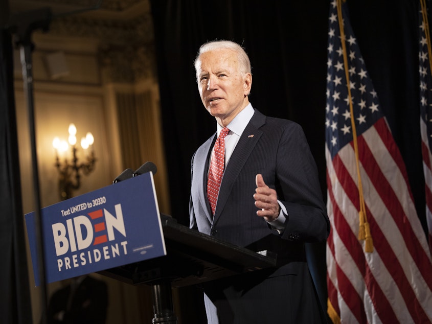 caption: Former Vice President Joe Biden at a press conference in Wilmington, Del., in mid-March. His bid this week to allow 60-year-olds to get Medicare "reflects the reality," he says, "that, even after the current crisis ends, older Americans are likely to find it difficult to secure jobs."