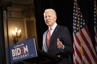 caption: Former Vice President Joe Biden at a press conference in Wilmington, Del., in mid-March. His bid this week to allow 60-year-olds to get Medicare "reflects the reality," he says, "that, even after the current crisis ends, older Americans are likely to find it difficult to secure jobs."