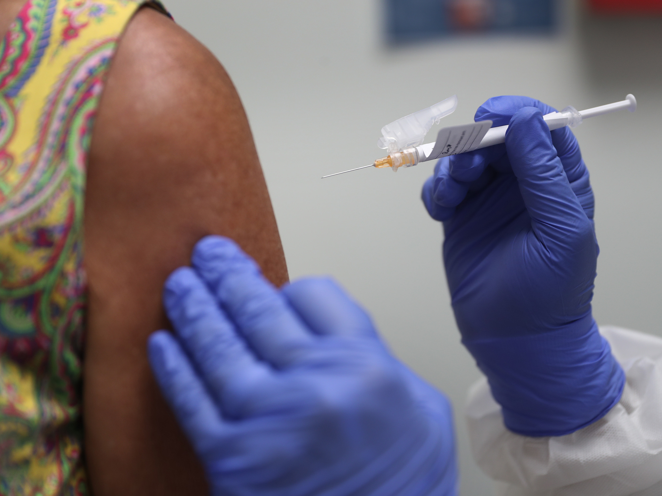caption: Lisa Taylor got a COVID-19 vaccination in August as part of a vaccine study at Research Centers of America in Hollywood, Fla.