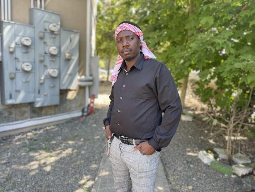 caption: Maktub Abdi is an Uber driver searching for an affordable place for his family of five to live in South Seattle.