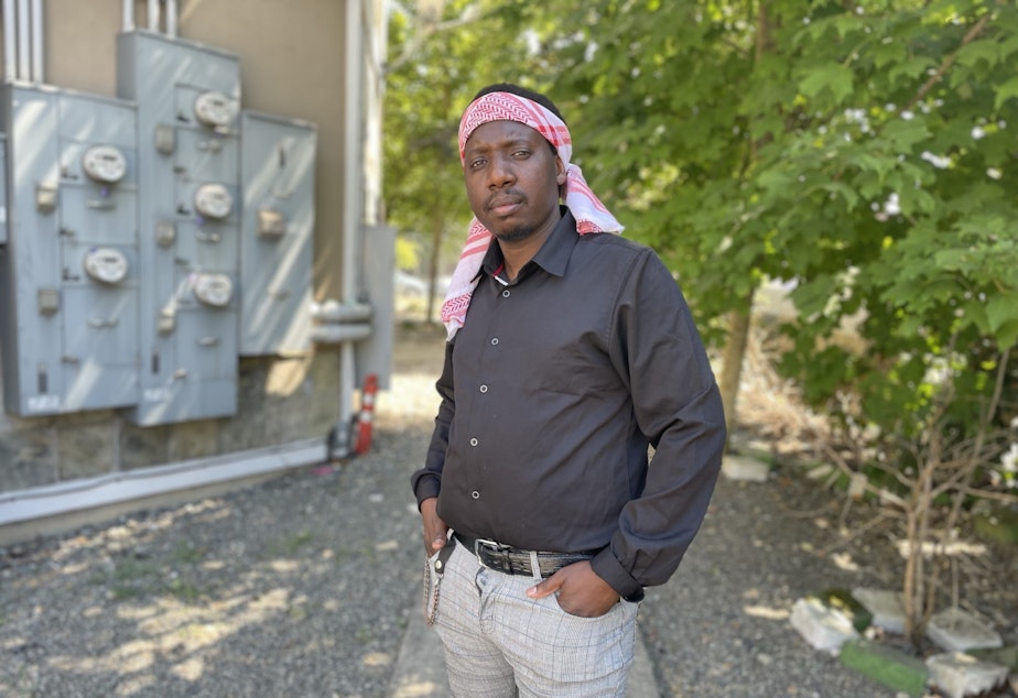 caption: Maktub Abdi is an Uber driver searching for an affordable place for his family of five to live in South Seattle.